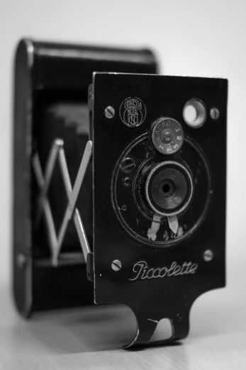 a black and white pograph of a camera