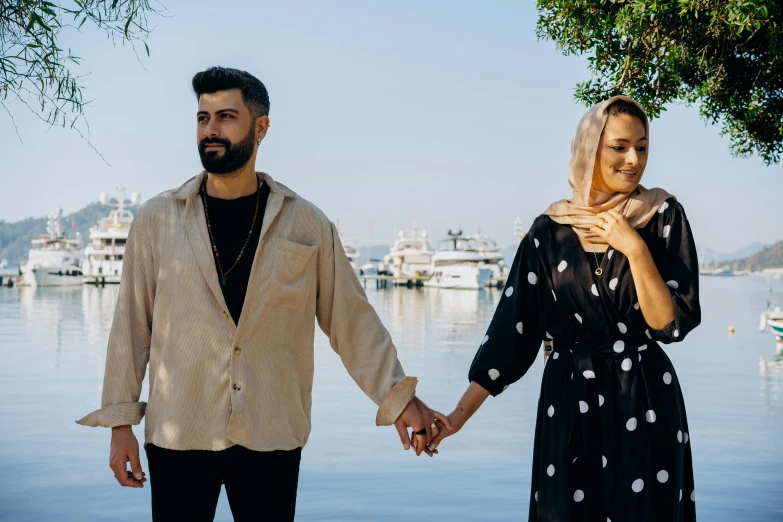 a couple holding hands walking hand in hand