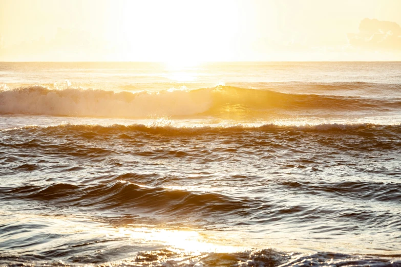 a person riding on a surfboard on a wave in the ocean