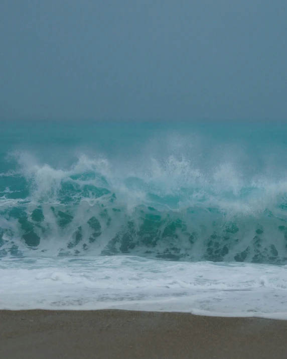 there is a man with a surfboard in the ocean