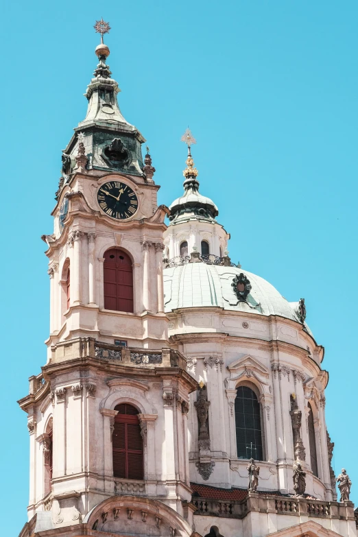 a large building with many windows and a clock on top