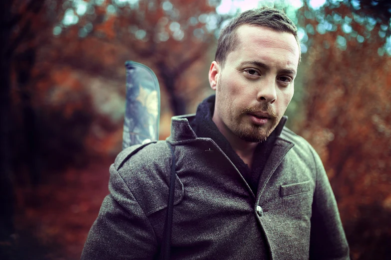 a man with a knife posing for the camera