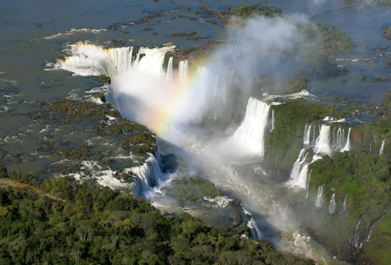 rainbow over the waterfall as it appears to be made of water