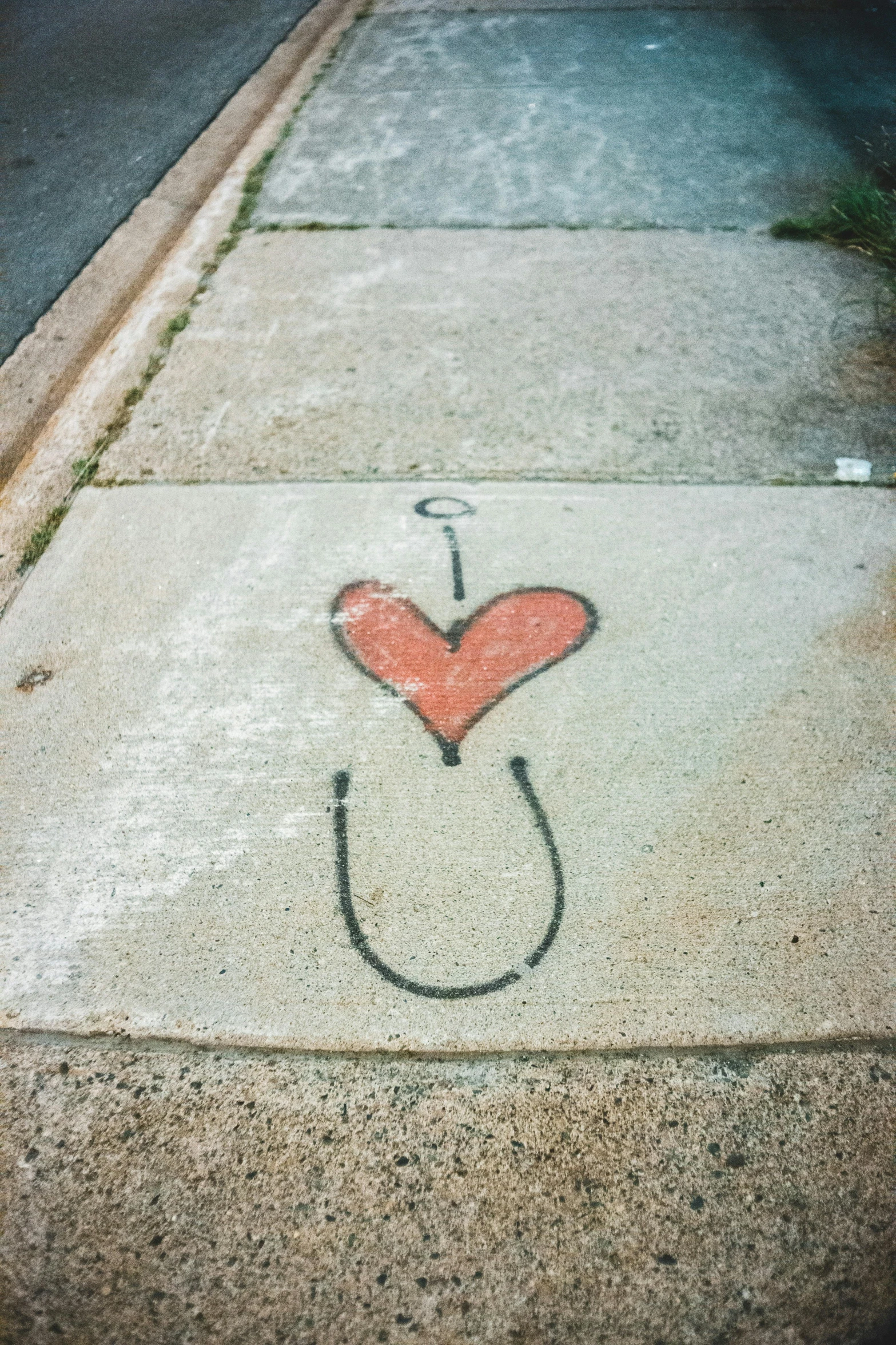 a sidewalk with some drawings on it