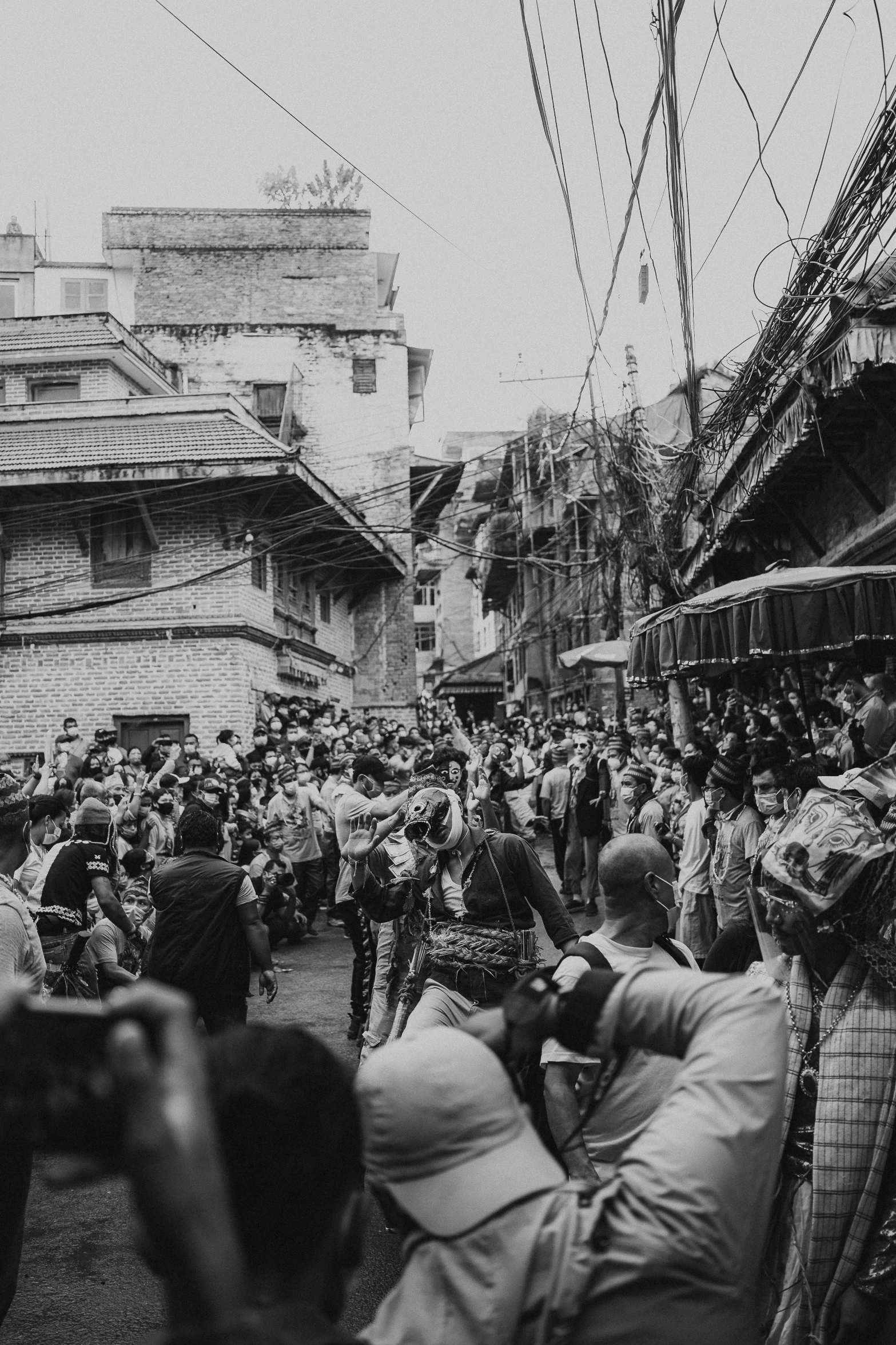 many people gathered together on a city street