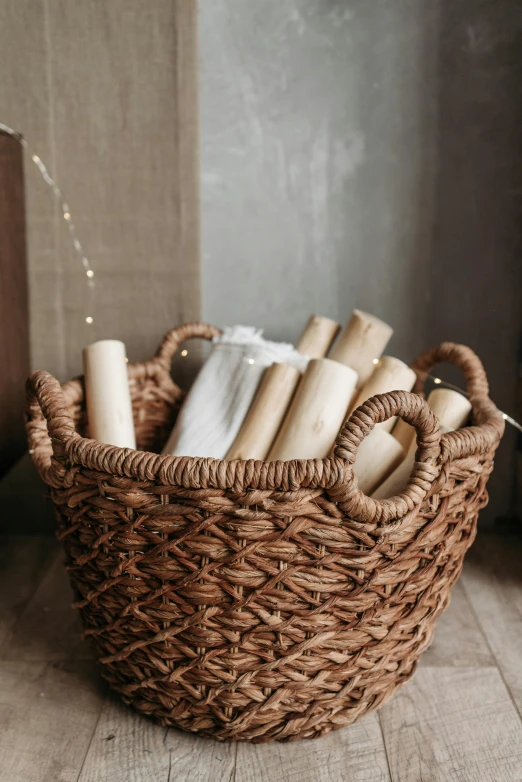 the wicker basket has candles in it