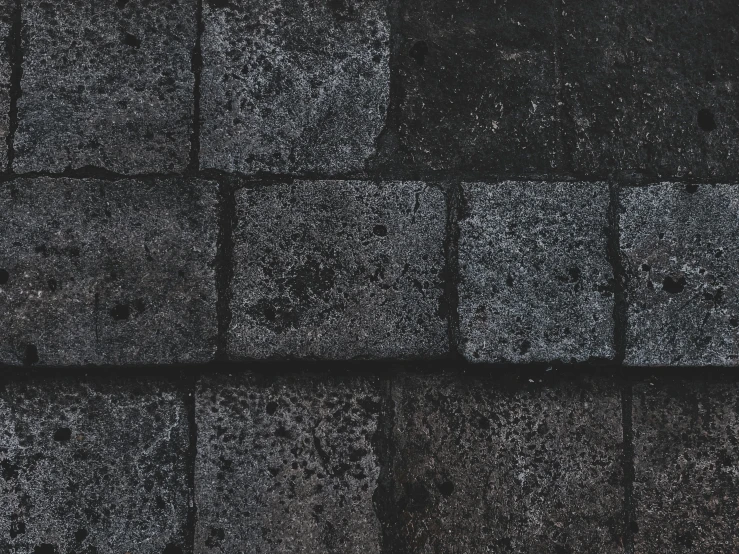 concrete blocks that have been lined with black and white markings