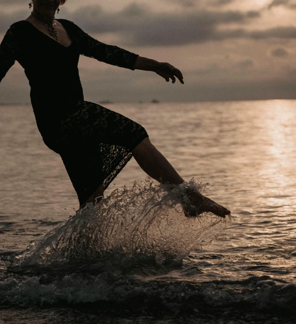 a girl with her leg in the water