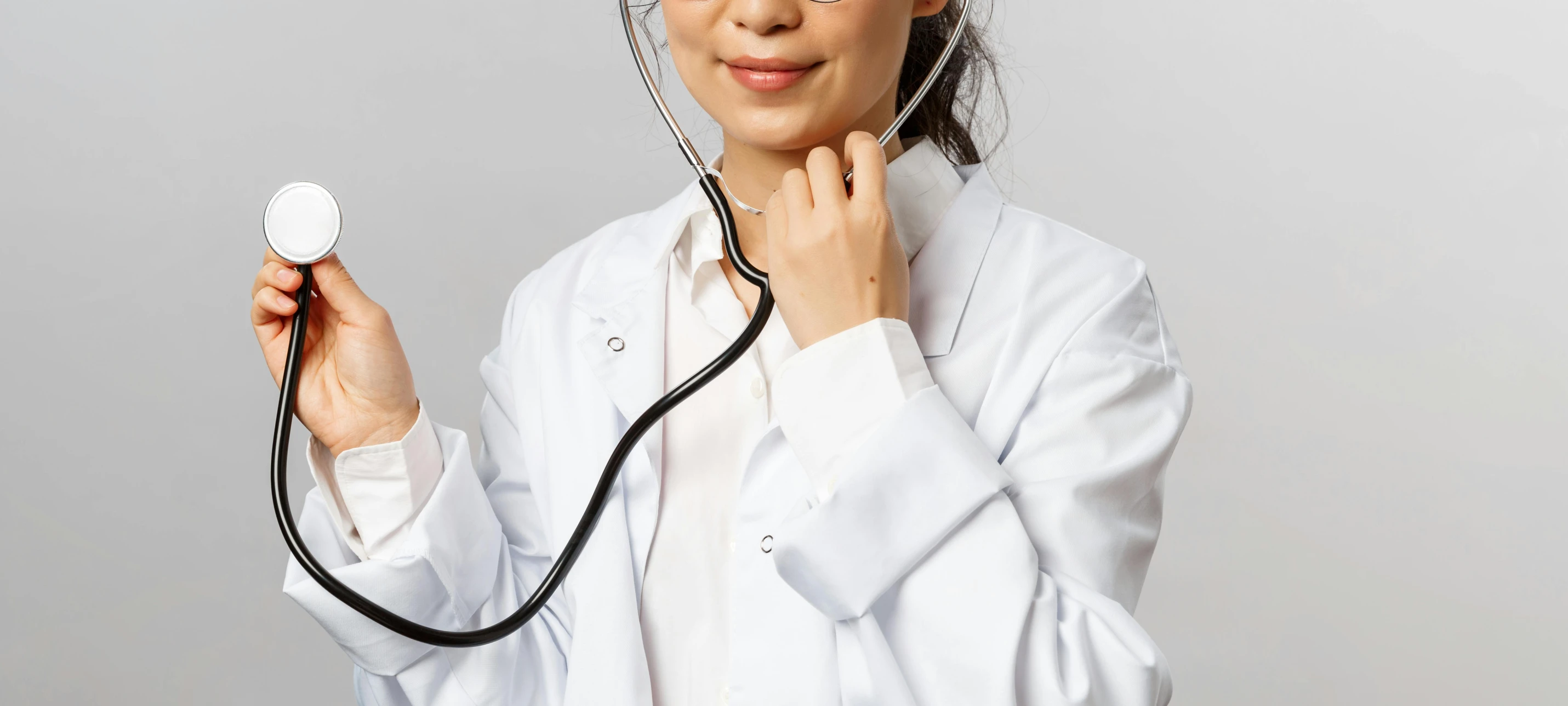 a woman is dressed up in medical wear holding soing with it's hand