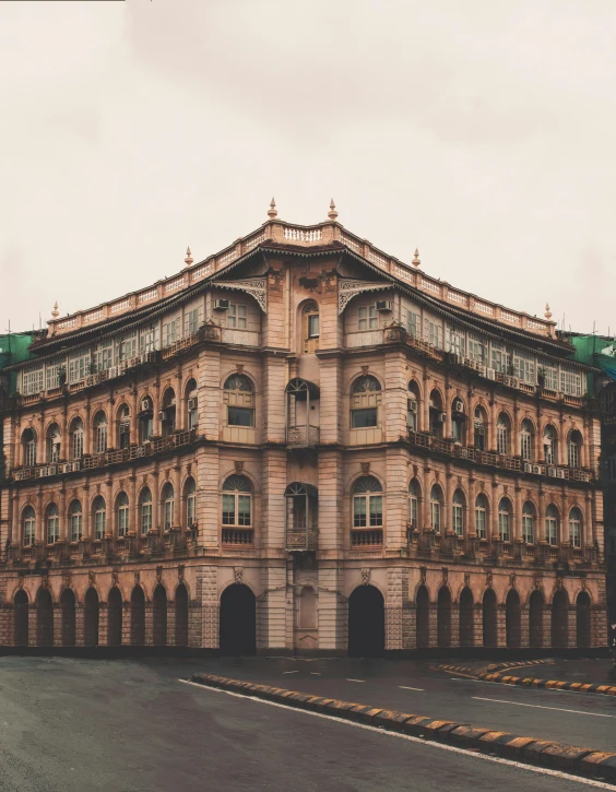 an old building on the corner of a street