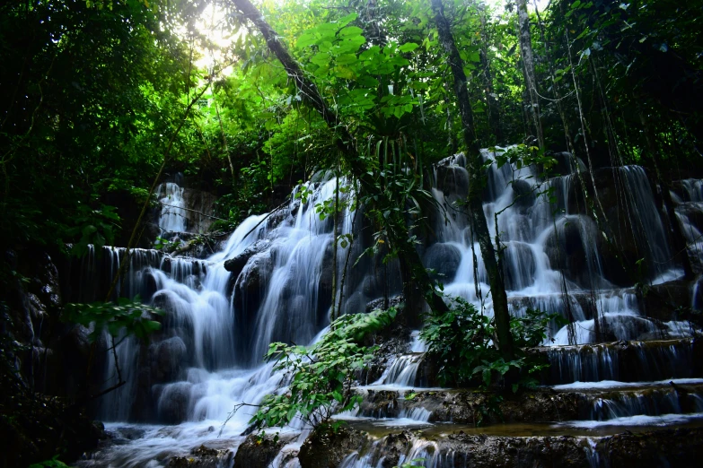 some water pouring out of a large waterfall