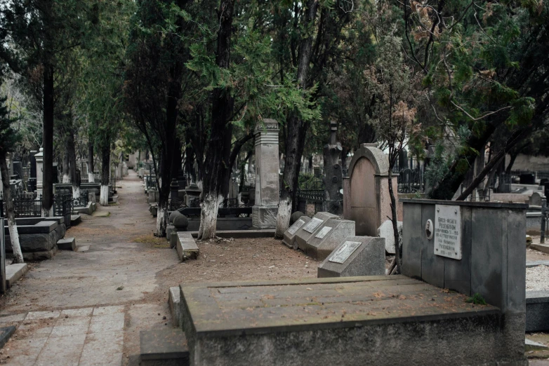 a cemetery filled with lots of grey tombstones