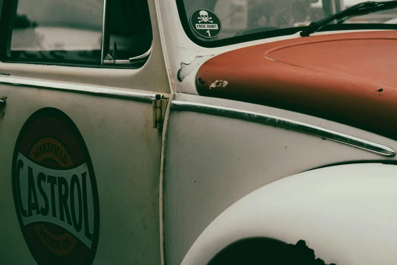 closeup of the side window and the emblem of an old, classic delivery truck