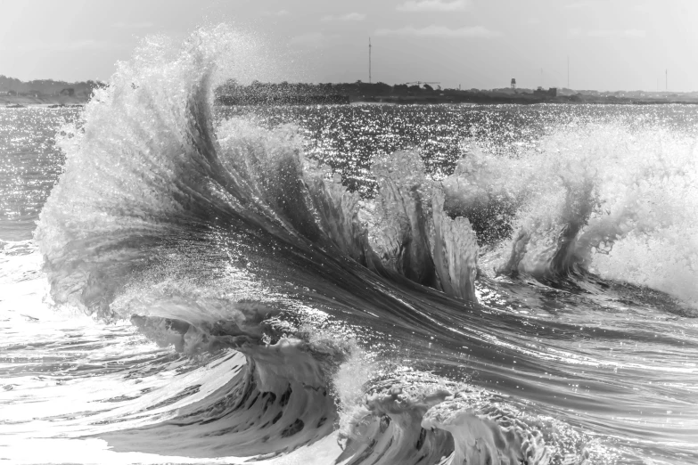 waves in front of an island in the ocean