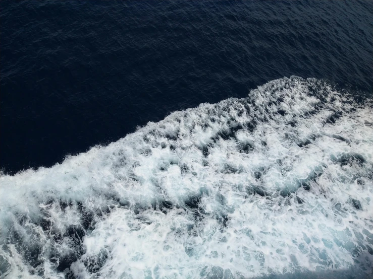 view from above of wake and waves in ocean