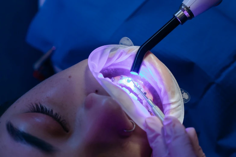 a man getting his eyebrows brushed in a salon