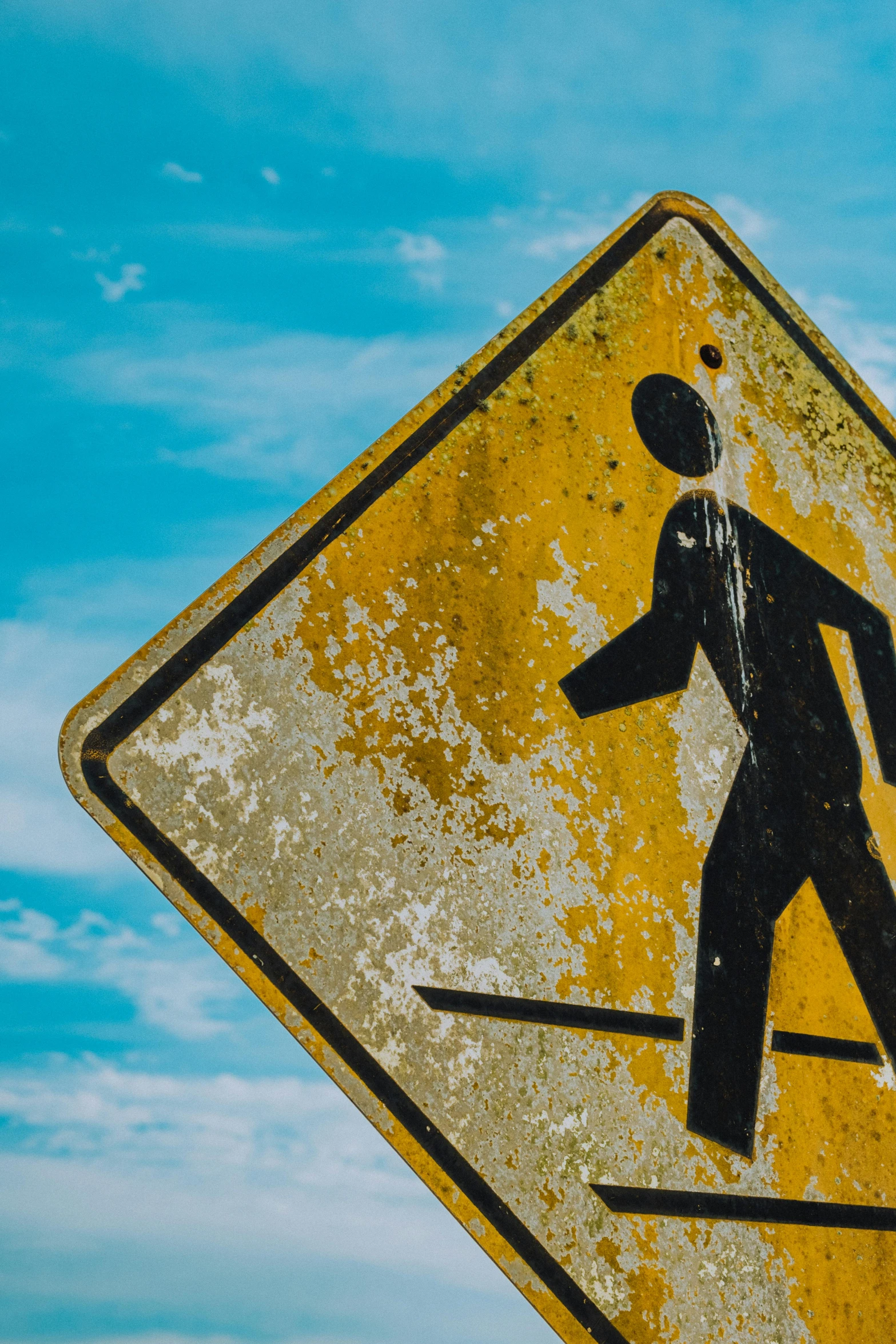 a sign warning that crossing is ahead for pedestrians