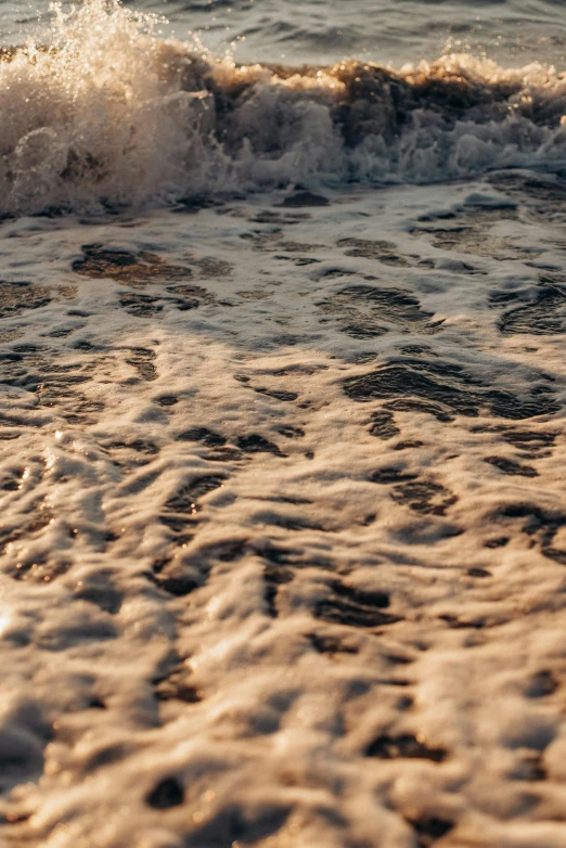 small waves and a beach ball on a sandy beach