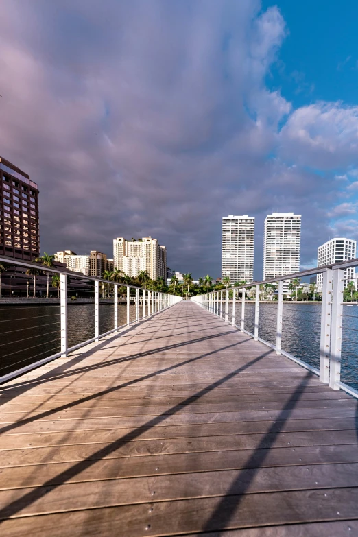 a pier is lined with buildings and water