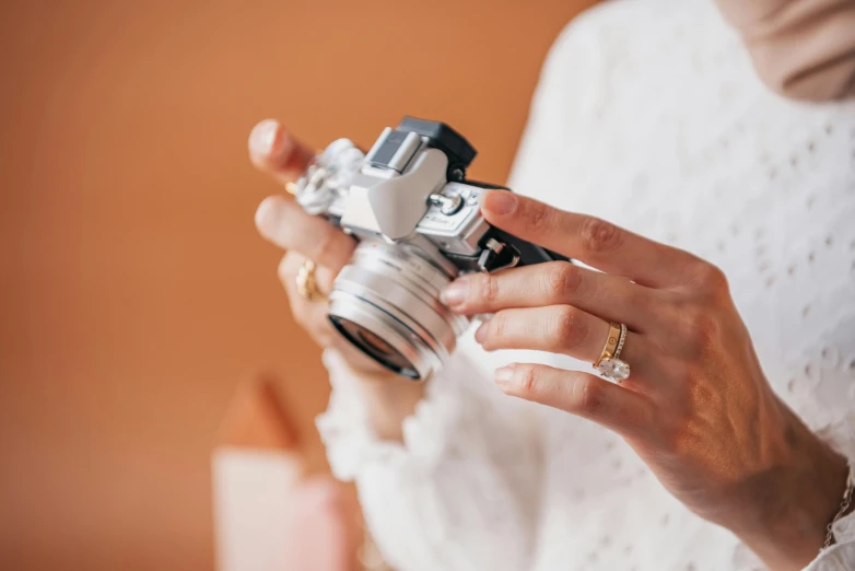 a woman holding a camera in her hands