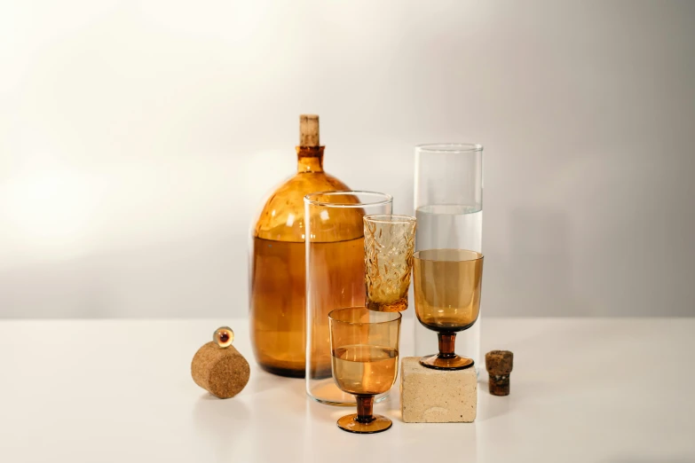 a table topped with different types of glasses and bottles