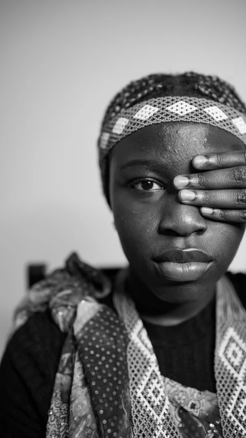 a woman with a scarf on top of her head