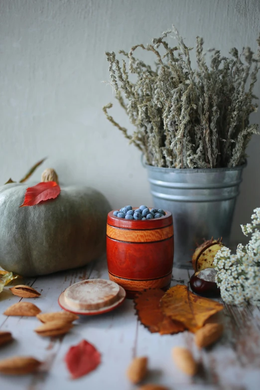 various vases and a dish of blueberries