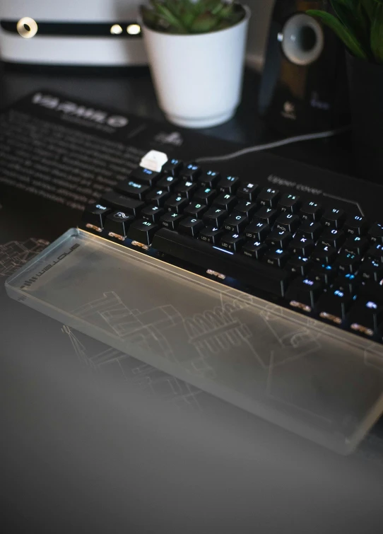 a close up of a keyboard sitting on a desk