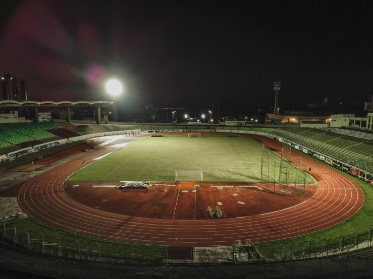 a stadium with a lot of seats and lights on