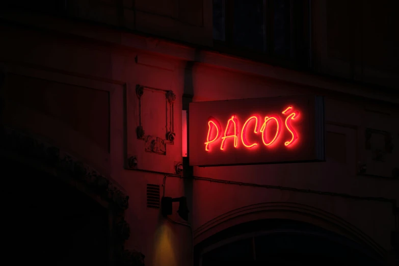 a neon sign that reads pascos on it's side