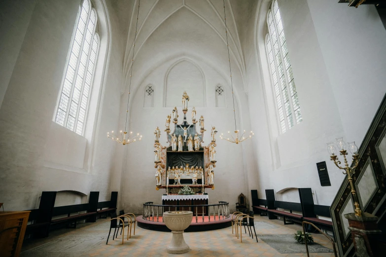 there are many chairs and a pew in a church