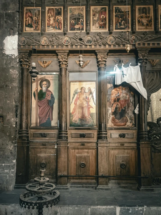 a building with an ornate decoration and pictures on the walls