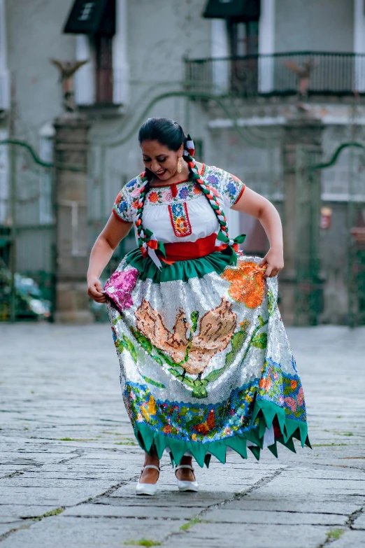 woman wearing an elaborate dress walking down the street