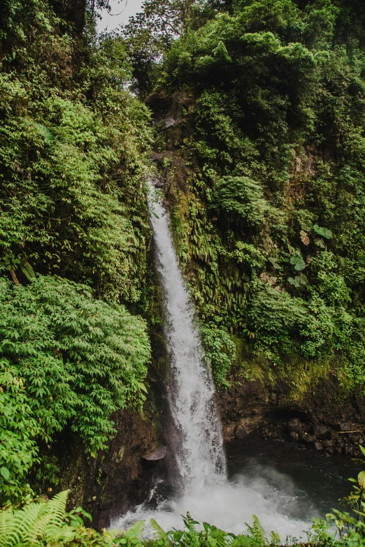 a close up view of a tall waterfall