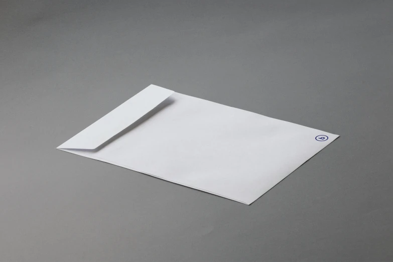 a piece of white paper that is on a grey background