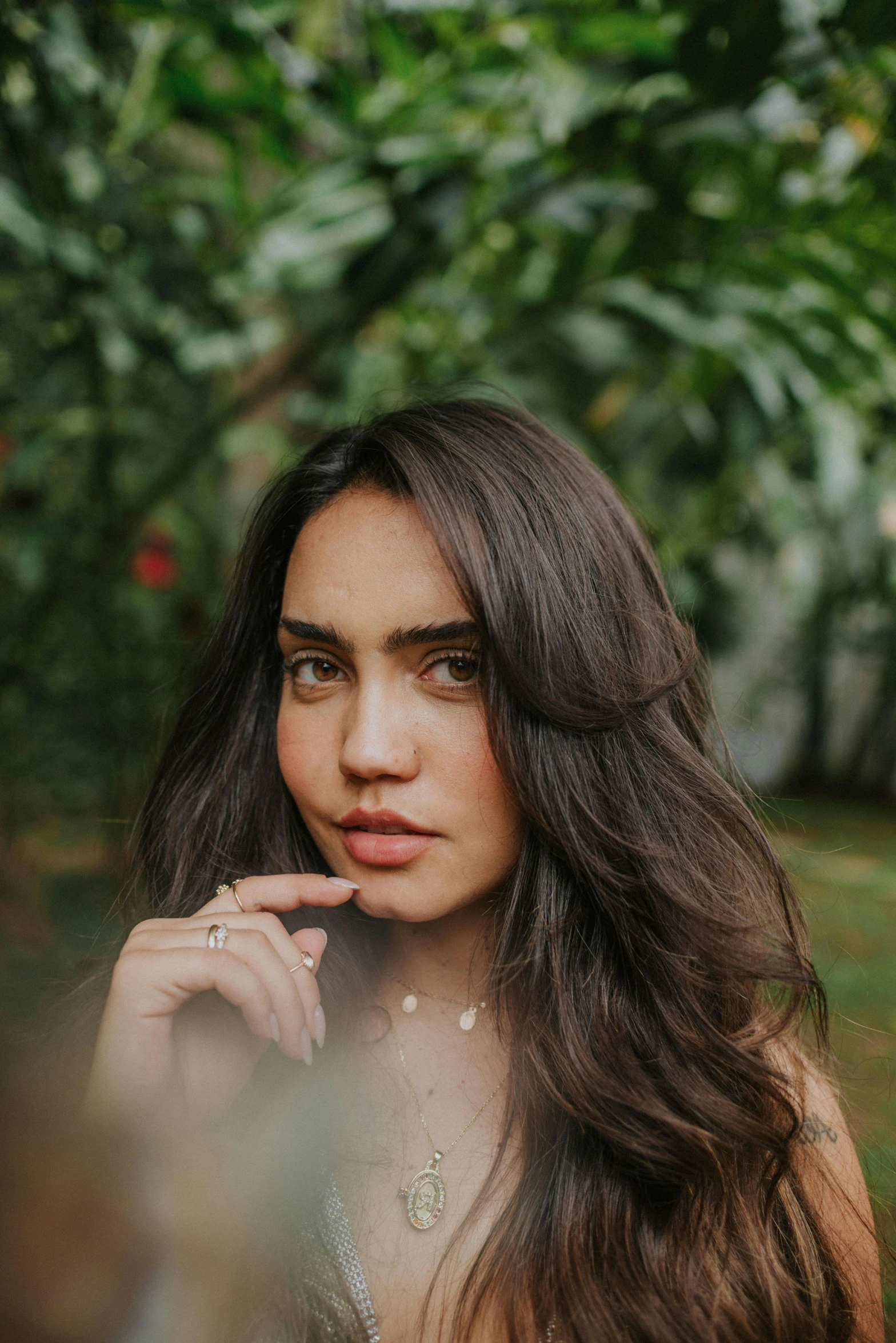 a woman is posing for a picture with long hair