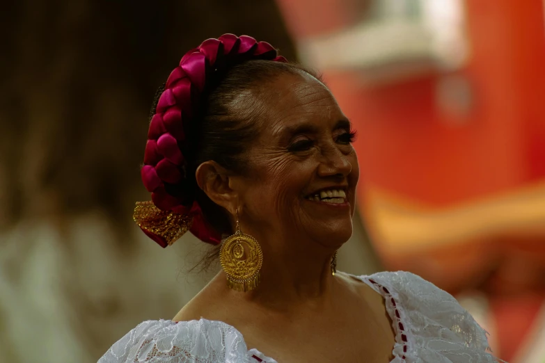 a woman with an orange bow in her hair and a dress