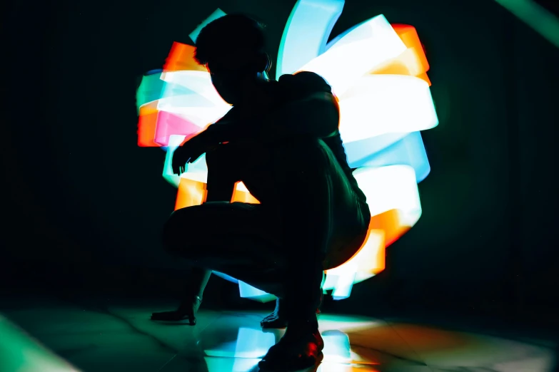 an artistic silhouette of a woman in a black background