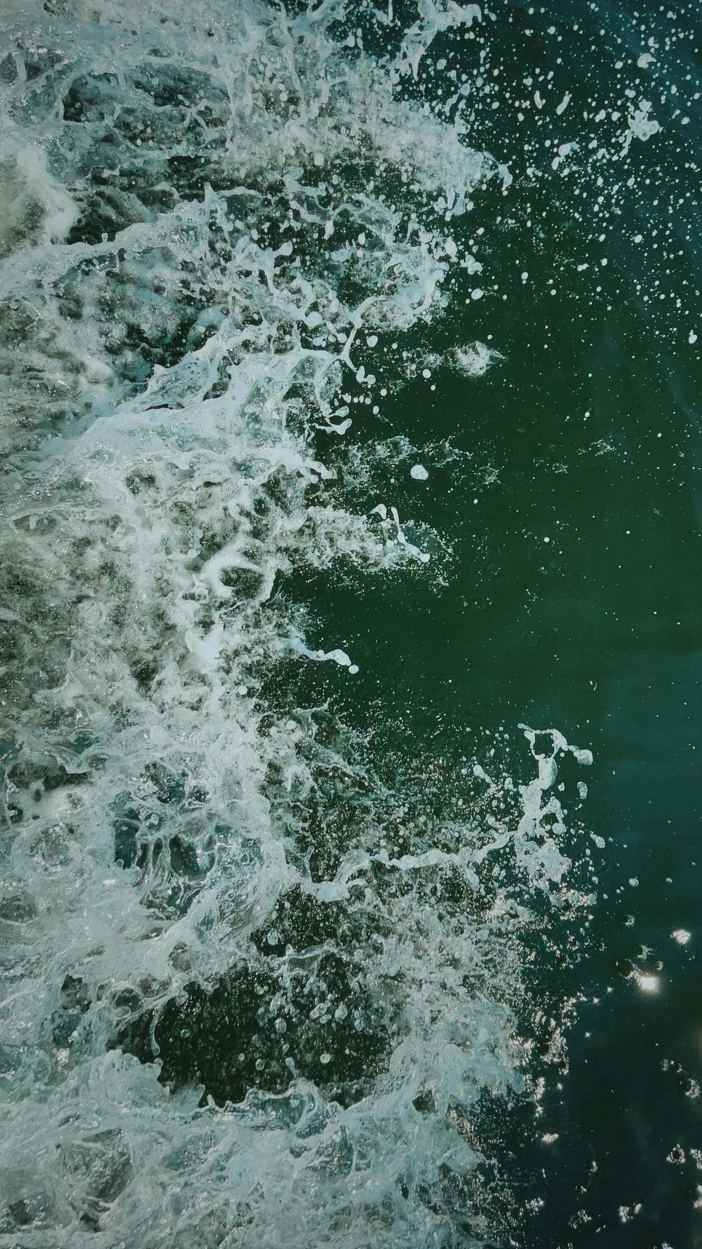 green and white water with small white bubbles