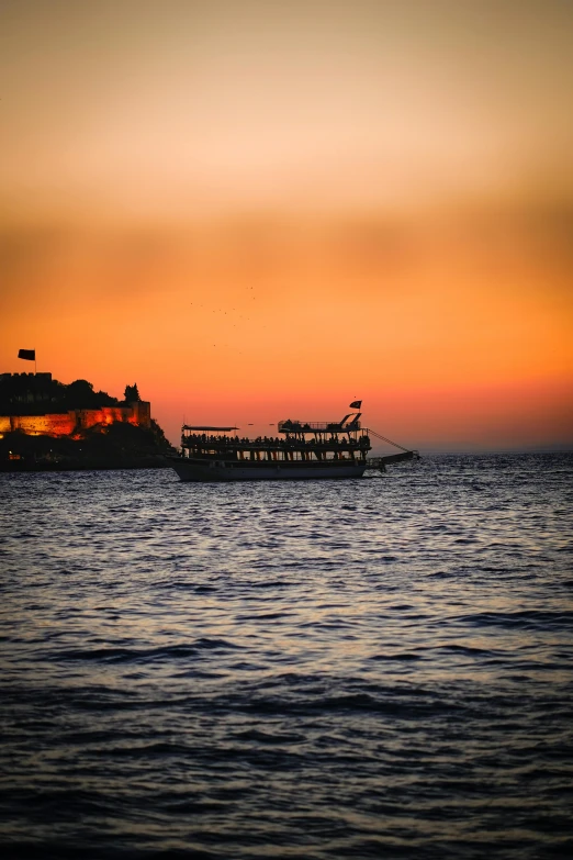 a large boat floating in the middle of the ocean