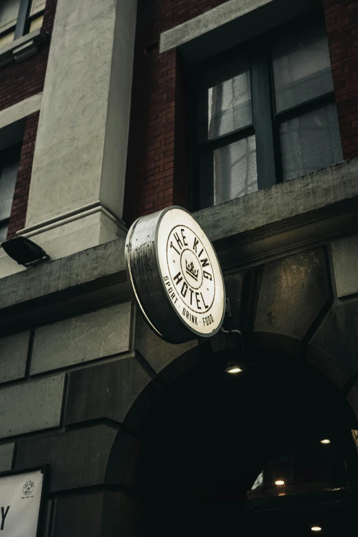 there is a clock that reads five o'clock on the outside of the building