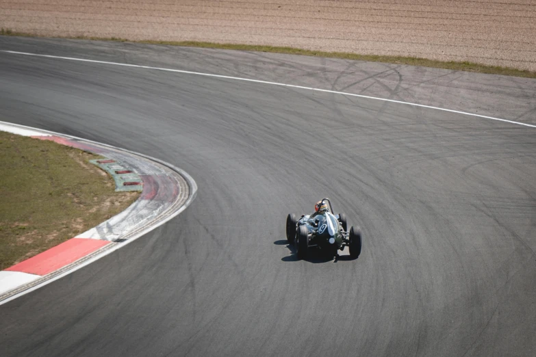 a person riding a bike on top of a racetrack