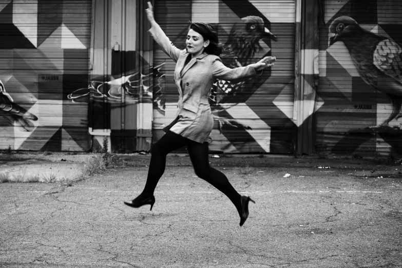 a woman running with her arms out