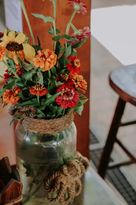 the vase has flowers and leaves in it