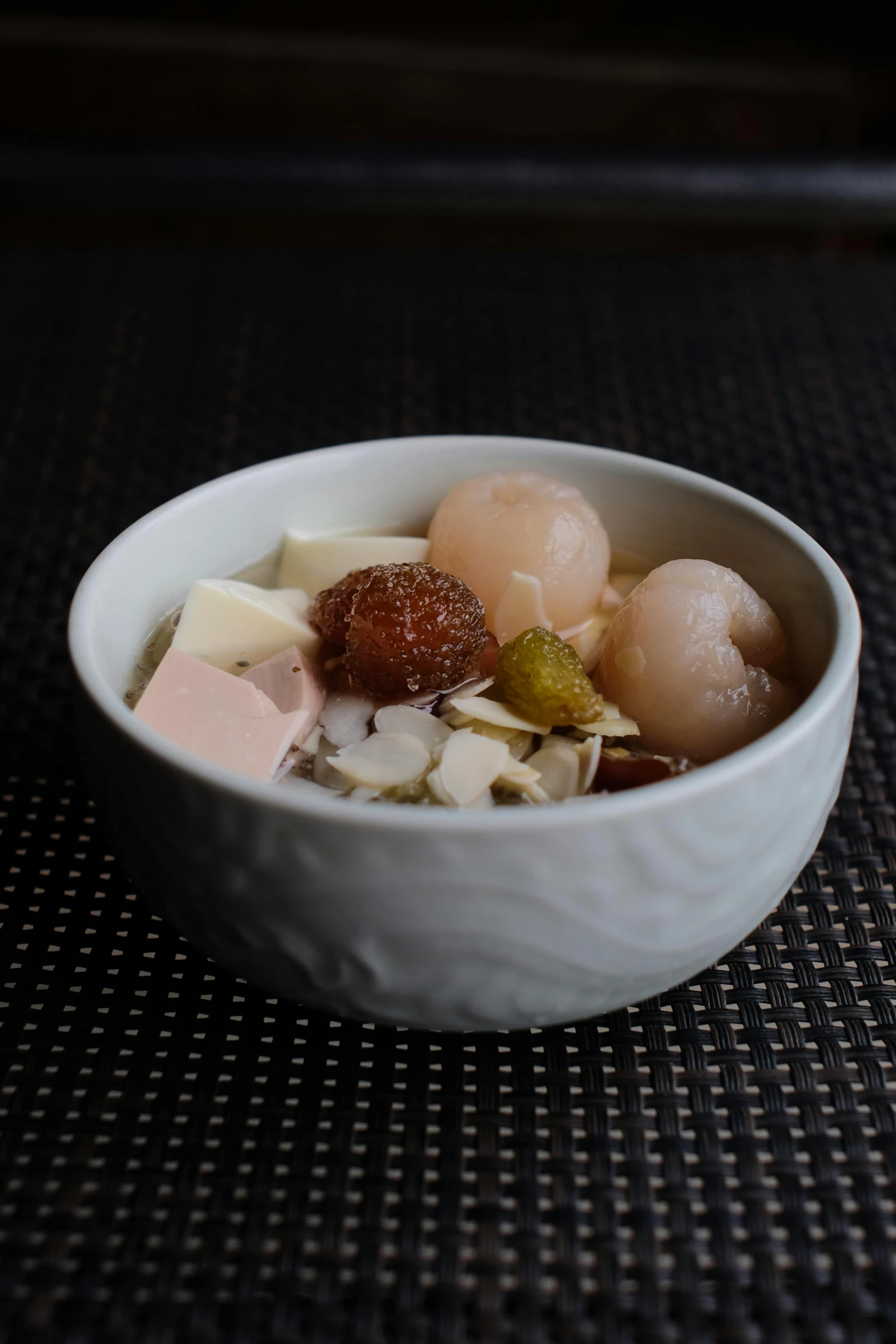 some food is in a white bowl on a table