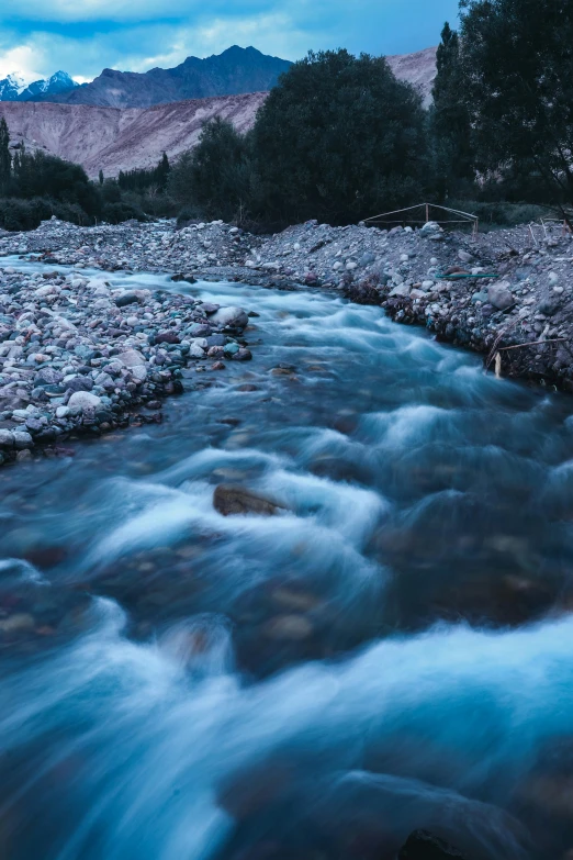 a small river is running through a rocky area