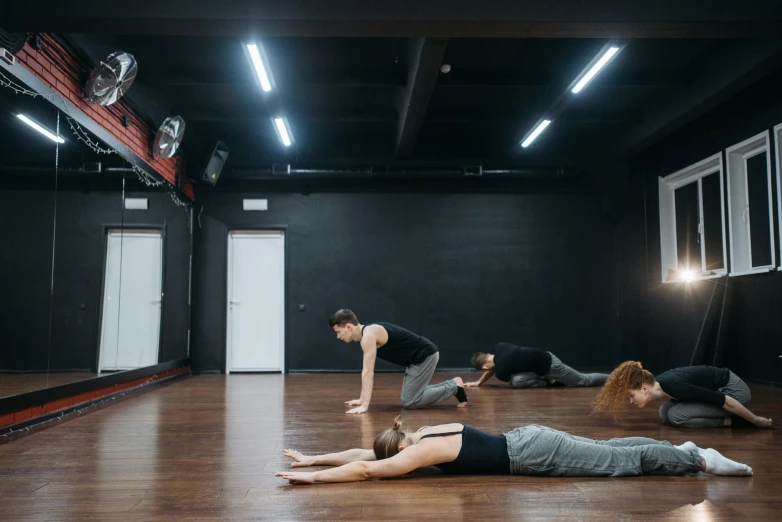 group of people on floor using different devices