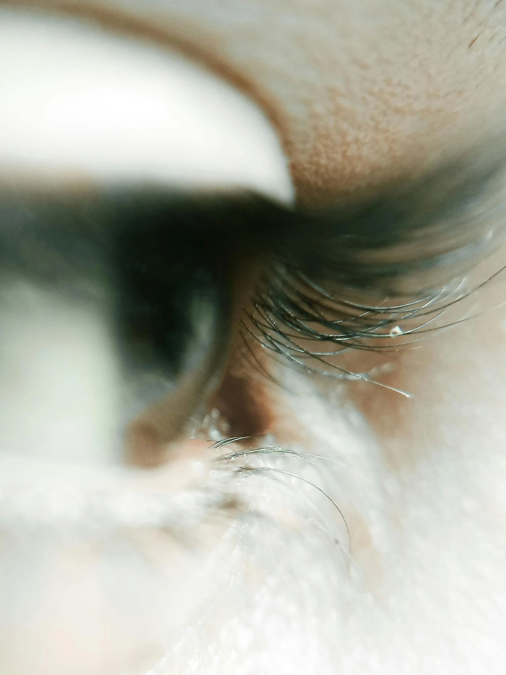 a close up s of someone's eye with some sort of white substance