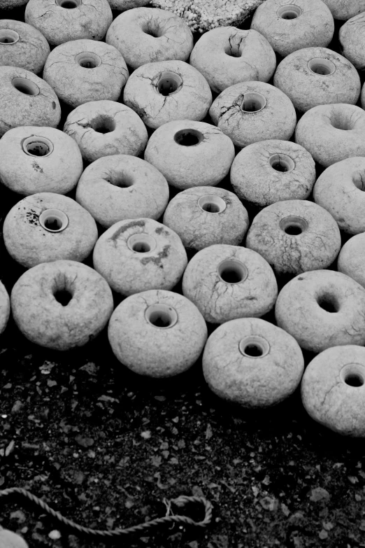 a bunch of doughnuts that are piled up