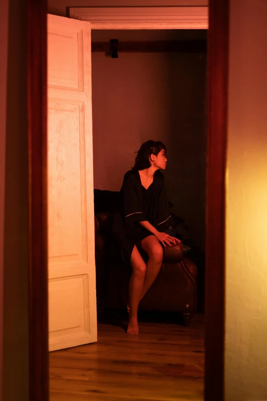 a person sitting in front of a doorway